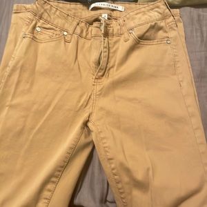 Tan mid rise skinny pants. Size 5/27